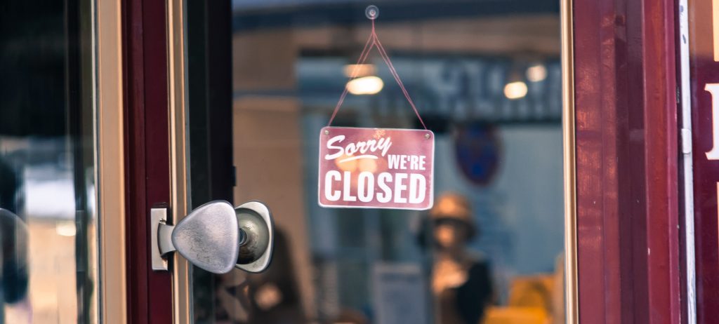 Close-Up Of Closed Sign At Store