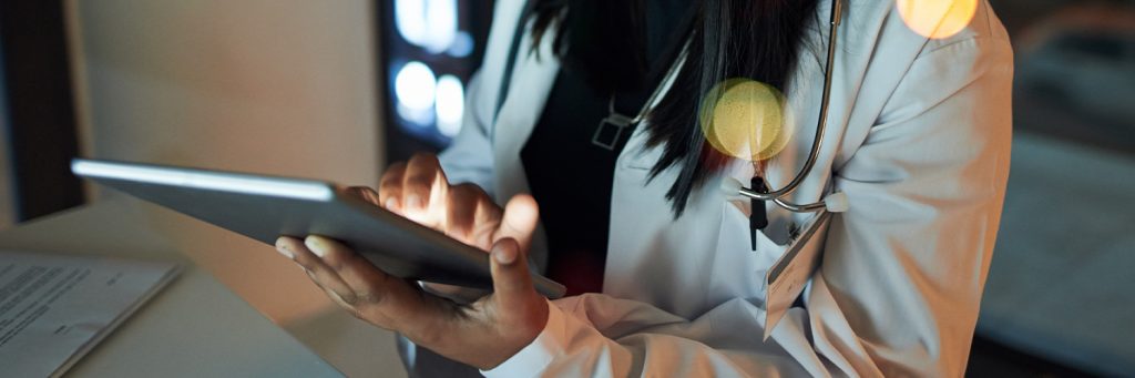 Female doctor using tablet