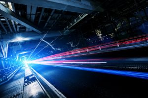 subway tracks with colorful lights