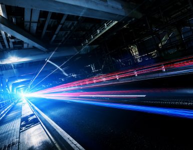 subway tracks with colorful lights