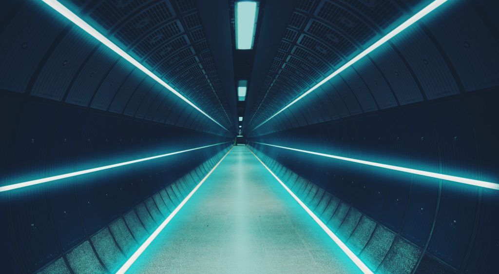 Cool underground tunnel with nice vanishing point and neon lights.