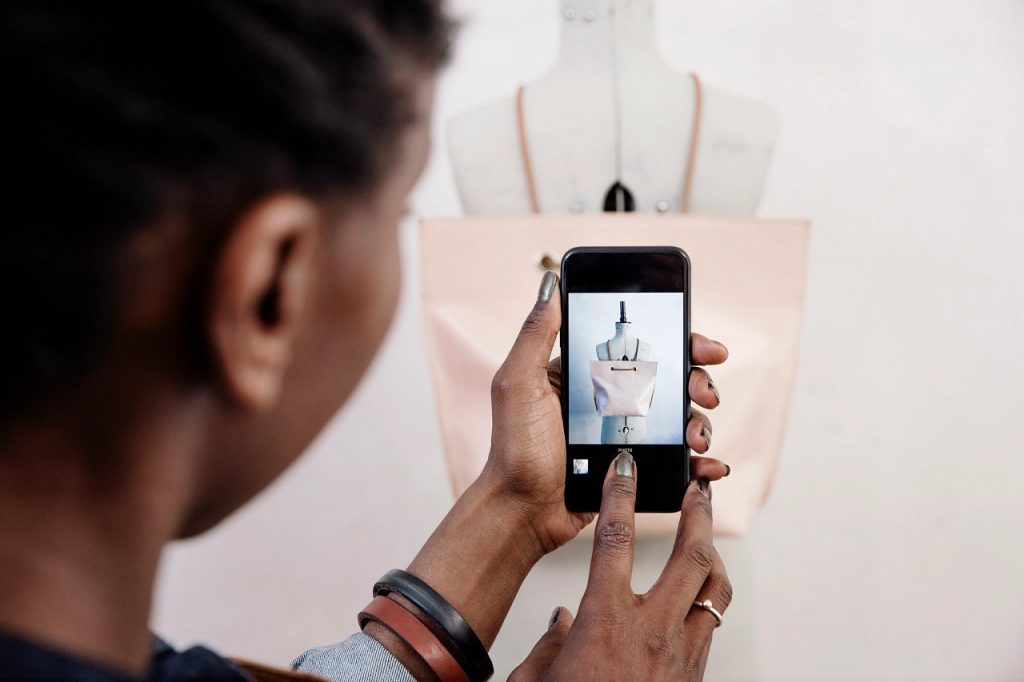 woman looking at retail app on smart phone