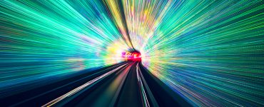 colorful rays of light traveling through a tunnel