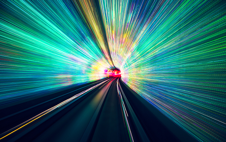 colorful rays of light traveling through a tunnel